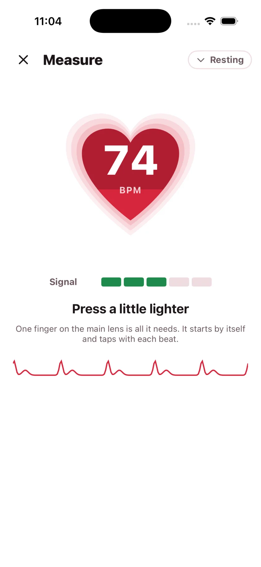 Taking a reading in HeartGlance: a large red heart filling from the bottom with 68 BPM inside it, a signal strength meter, and a live pulse trace.